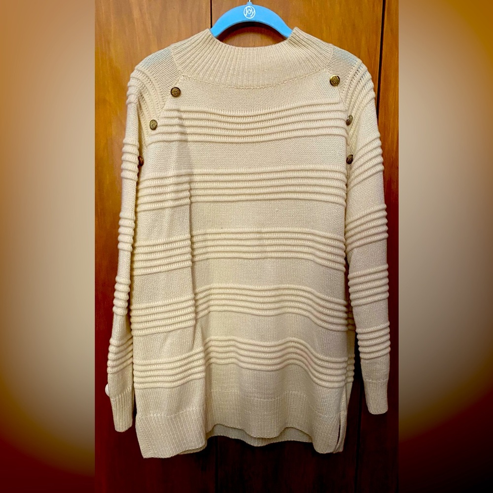 Cream colored sweater with 3 shoulder buttons on each shoulder. Size Large